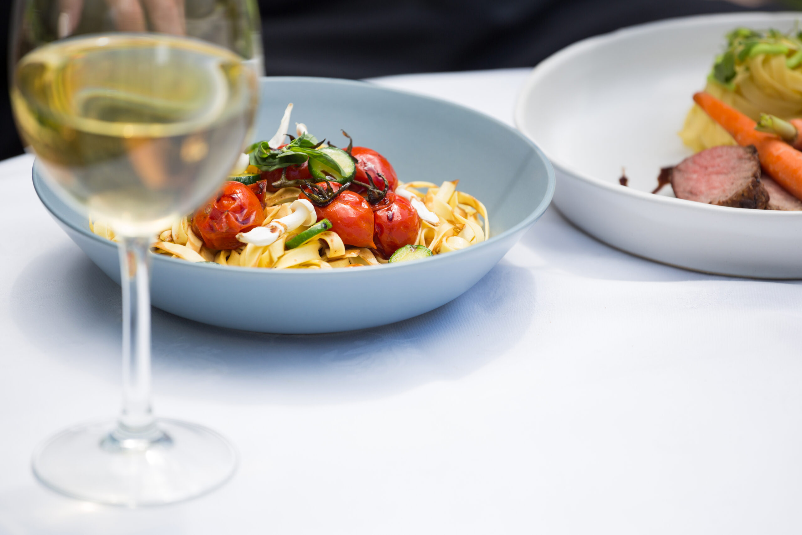 lunch and wine glass on dining table at restaurant KBETZSL